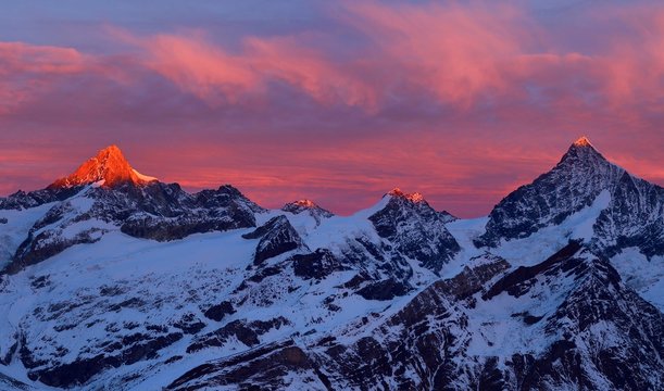 Zinalrothorn with snow in red dawn glow, Dent Blanche right, Gornergrat, Zermatt, Canton of Valais, Switzerland, Europe
