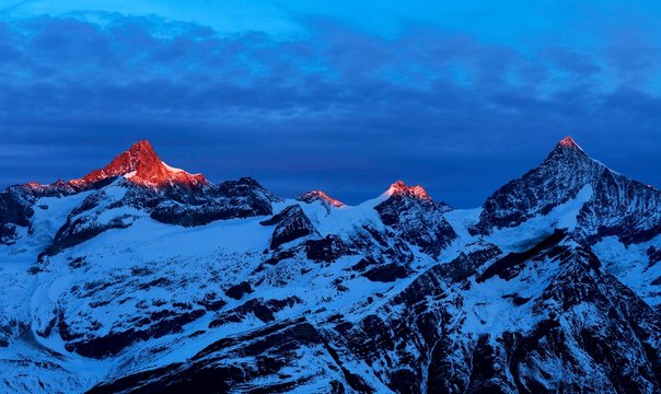 Zinalrothorn with snow in red dawn glow, Dent Blanche right, Gornergrat, Zermatt, Canton of Valais, Switzerland, Europe