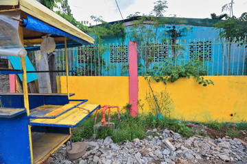 Fototapeta na wymiar Abandoned foodcart painted yellow and blue. Puerto Princesa-Palawan-Philippines-0741
