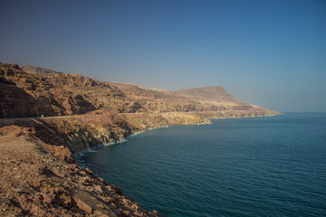 Obraz na płótnie Canvas panoramic travel photography of dead sea rocky mountain ridge along waterfront outdoor desert Middle East scenery landscape without people