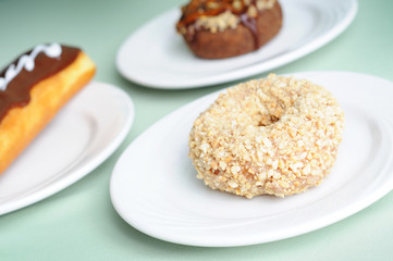 Eclair and Donut Pastries - Unhealthy Breakfast Eating