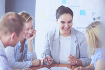 Obraz premium Young people studying with books on desk. Beautiful women and men working together.