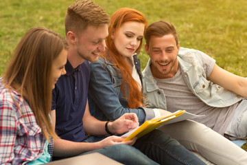 College friends chatting outdoors at the campus