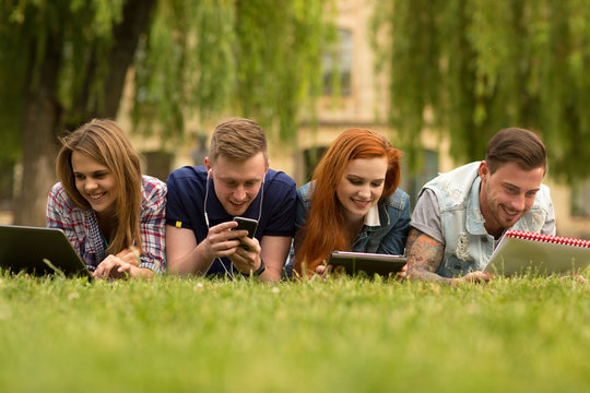 College friends chatting outdoors at the campus