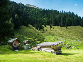 Wooden mountain farm buildings with solar panels the Pinnistal valley branches off from the Stubai valley, Stubai Alps, Tyrol, Austria, Europe