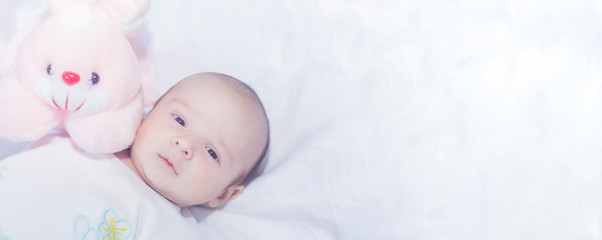 Cute newborn baby boy with easter pink easter bunny