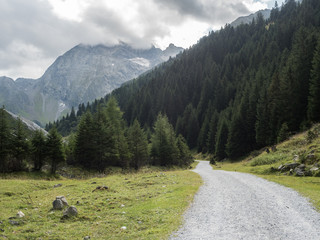 Fototapeta na wymiar Mountain landscape with road, the Pinnistal valley branches off from the Stubai valley, Stubai Alps, Tyrol, Austria, Europe