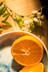 fresh orange in ceramic plate