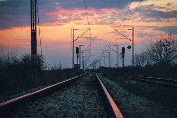 Fototapeta na wymiar Sunset on the railroad tracks landscape.
