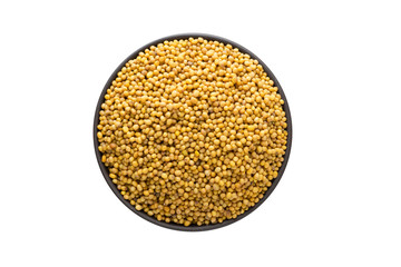 mustard seeds in clay bowl isolated on white background. Seasoning or spice top view