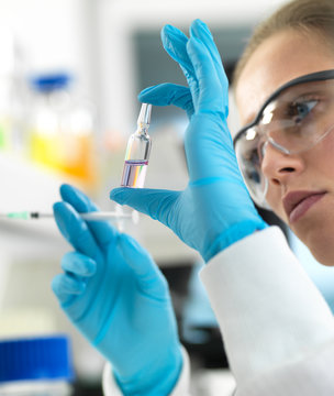 Pharmaceutical Research, Scientist Preparing A New Drug For Testing In The Laboratory