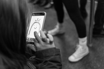 Child drawing in a phone