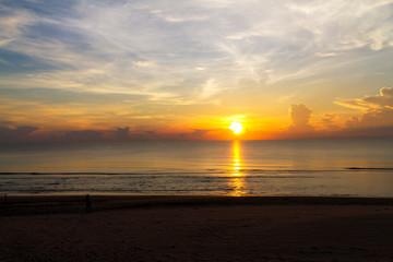 Sunrise on sea and shadow on baech at beach