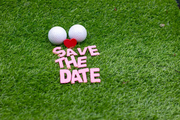 Golf ball with love Save the Date on green
