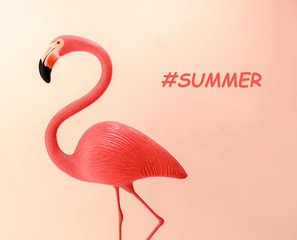 Flamingo shape on coral color gradient background. Flat lay minimal, trendy summer concept layout