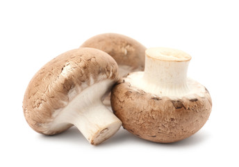 Fresh raw champignon mushrooms on white background