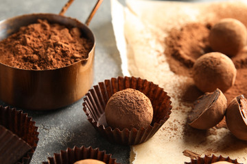 Composition with chocolate truffles on grey background