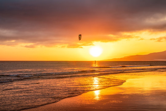 Spain, Andalucia, Tarifa, kite surfer at sunset