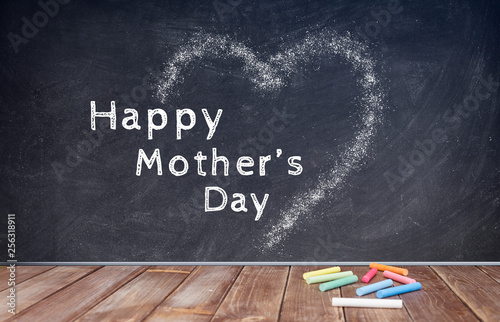 happy mother's day writing on blackboard. Mother's Day greeting card