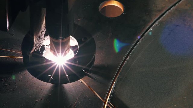 Close-up Top View Of The Laser Head Cuts A Metal Sheet