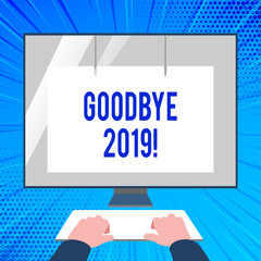 Handwriting text writing Goodbye 2019. Conceptual photo express good wishes when parting or at the end of last year Hands on Mockup Keyboard Front of Blank White Monitor with Screen Protector