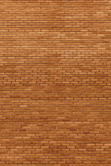 Red beige bricks stone wall decorative background closeup, vertical grunge pattern, old aged weathered texture, natural grungy textured reddish vintage, rough rustic brick birckwork