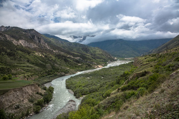 Fototapeta na wymiar The mountain river in the beautiful gorge. The wild nature in mountains of the North Caucasus