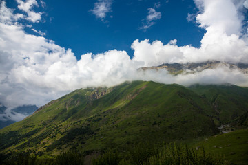 Obraz na płótnie Canvas Mountains of the North Caucasus, mountain tops in clouds. Wild nature