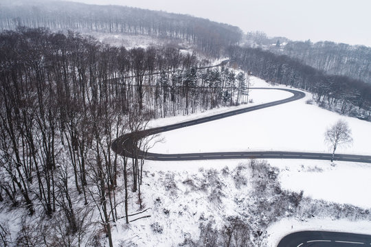 Austria, Wienerwald, drone shot of a snowy mountain road