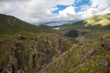 Fototapeta premium Mountains of the North Caucasus, mountain tops in clouds. Wild nature