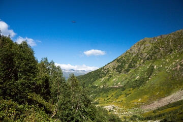 Mountains and the nature of the North Caucasus, the blue sky over high rocks in the beautiful gorge