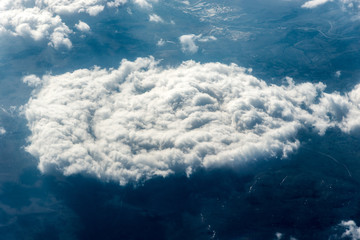 Naklejka premium Top view of white clouds above the ground or water