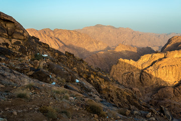 Fototapeta premium Middle East or Africa, picturesque bare mountain range and a large sandy valley desert landscapes landscape photography