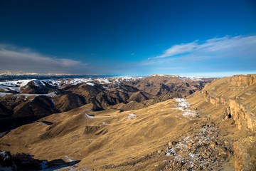 Fototapeta premium Mountains and the nature of the North Caucasus, the blue sky over high rocks in the beautiful gorge