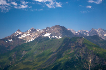 Mountains and the nature of the North Caucasus, the blue sky over high rocks in the beautiful gorge