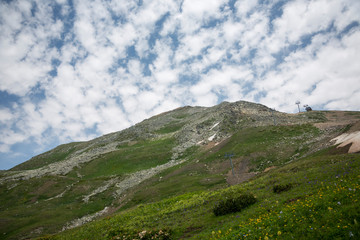 Fototapeta na wymiar Mountains of the North Caucasus, mountain tops in clouds. Wild nature
