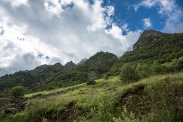 Mountains of the North Caucasus, mountain tops in clouds. Wild nature