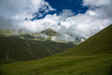 Obraz na płótnie Canvas Mountains of the North Caucasus, mountain tops in clouds. Wild nature