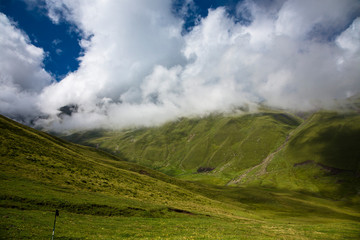 Mountains of the North Caucasus, mountain tops in clouds. Wild nature