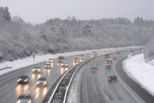 Germany, motorway in winter, icy road and traffic