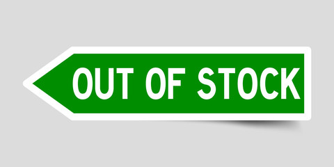 Arrow shape green color sticker in word out of stock on gray background