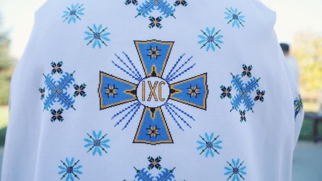 The frame is behind �atholic priests religious bible christian church spirituality religion christianity people worship cross faith holy mass prayer cardinal slow motion