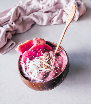ice cream with blueberries in coconut husk
