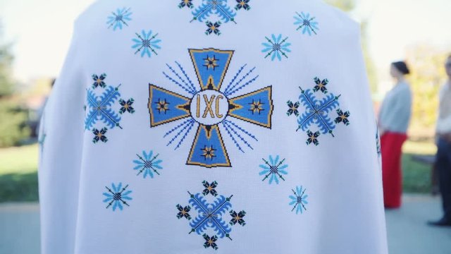 Close up frame is behind �atholic priests religious bible christian church spirituality religion christianity people worship cross faith holy mass prayer cardinal slow motion