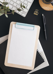 Workspace on black table. Top view.