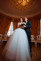 Wedding photo in a chic room.Couple in love