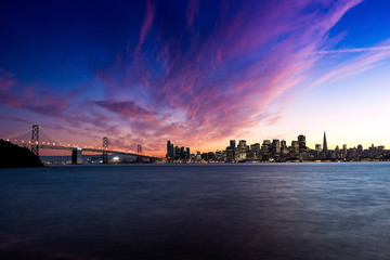 USA, California, San Francisco skyline and Oakland Bay Bridge at sunset