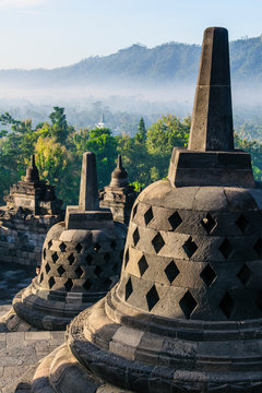 Indonesia, Java, Borobudur Temple Complex, stupas in early morning light