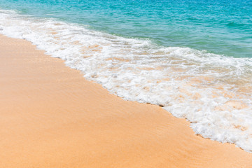 Fototapeta na wymiar soft sea wave on sand beach