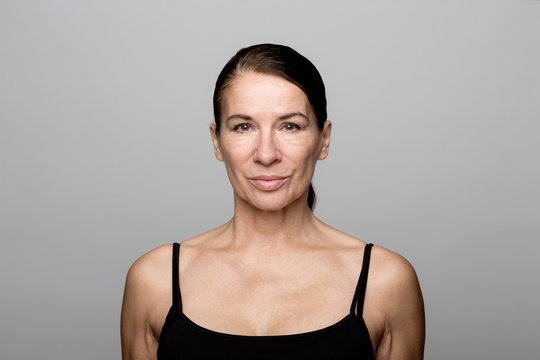 Portrait of serious mature woman wearing black top